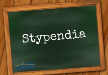 Na grafice tablica szkolna z napisem 'Stypendia'. W dolnym lewym rogu logo Gminy Żukowo. - powiększ
