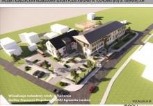Na zdjęciu projekt rozbudowy Szkoły podstawowej w Tuchomiu. Widoczny jest budynek szkoły, drogi dojazdowe, parkingi i boisko. - powiększ